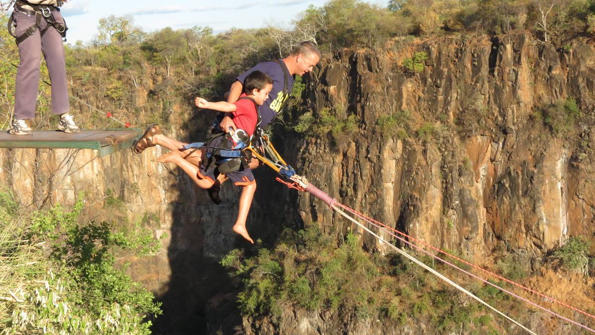 A tandem gorge swing launch from the platform edge above the Batoka Gorge at Victoria Falls